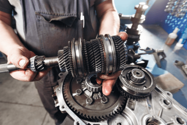Cross-section of a car gearbox. mechanic work in the garage.